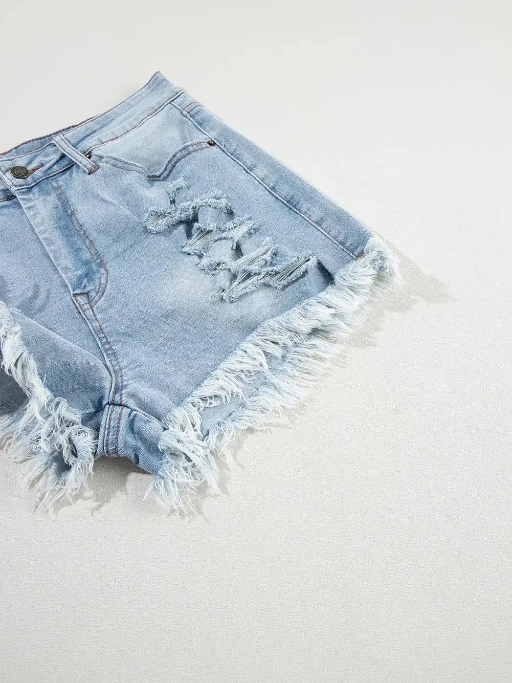 LIGHT BLUE DISTRESSED DENIM SHORTS