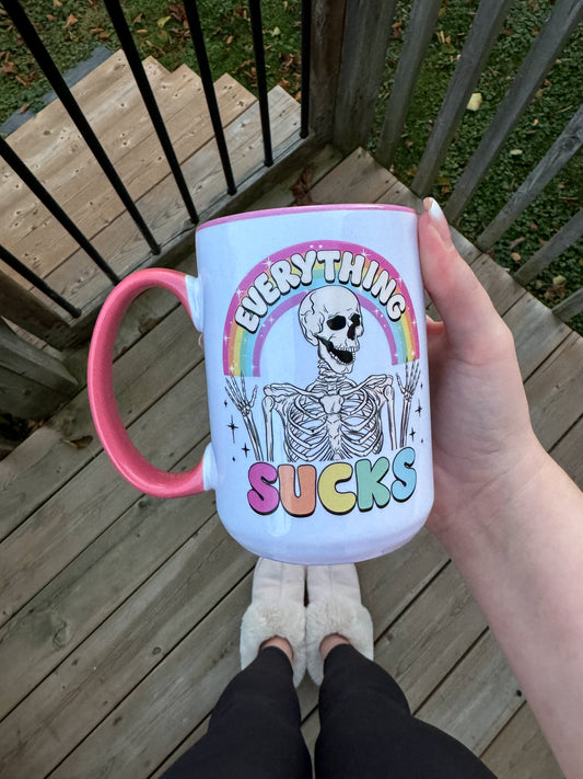 EVERYTHING SUCKS MUG