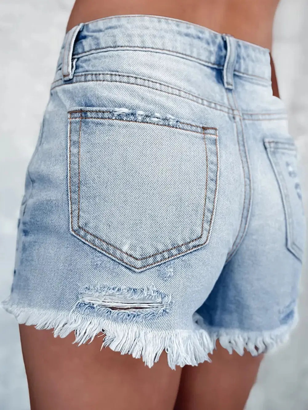 LIGHT BLUE DISTRESSED DENIM SHORTS